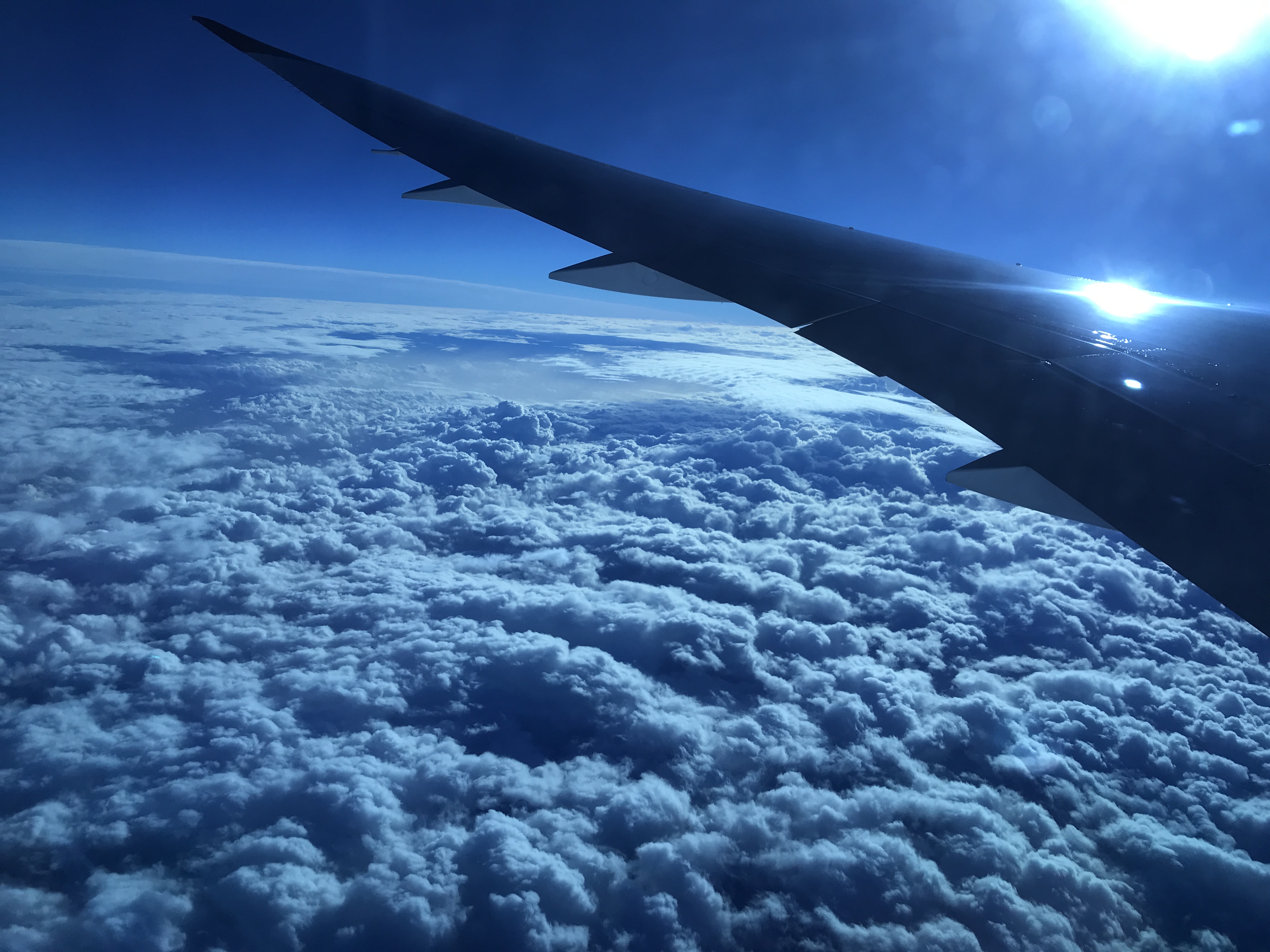 Plane wing and clouds